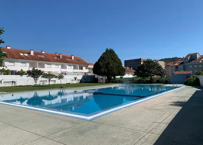 Urbanizacion Con Piscina Arnelas *